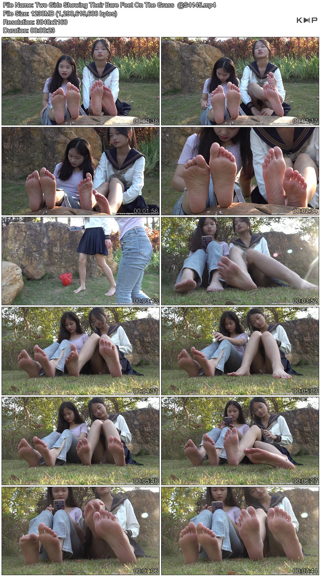 Two Girls Showing Their Bare Feet On The Grass  @S4145.JPG